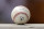 A spring training baseball ball with a Cactus League logo sits on a dugout wall during a game between the Arizona Diamondbacks and Los Angeles Angels Thursday, March 21, 2019, in Scottsdale, Ariz. (AP Photo/Elaine Thompson)