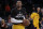 Los Angeles Lakers' Kobe Bryant warms up before an NBA basketball game against the Sacramento Kings, Tuesday, Dec. 9, 2014, in Los Angeles. Several athletes have worn