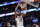 New Orleans Pelicans center Derrick Favors (22) slam-dunks over Boston Celtics center Daniel Theis in the first half of an NBA basketball game in New Orleans, Sunday, Jan. 26, 2020. (AP Photo/Gerald Herbert)