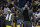 Los Angeles Lakers player DeMarcus Cousins, right, who previously played with the New Orleans Pelicans cheers for his team during an NBA basketball game in New Orleans, Wednesday, Nov. 27, 2019. (AP Photo/Matthew Hinton)