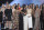 Jennifer Garner, front, embraces gymnast Aly Raisman after presenting the Arthur Ashe Award for Courage, at the ESPY Awards at Microsoft Theater on Wednesday, July 18, 2018, in Los Angeles. Holding hands in front left are former gymnast Sarah Klein and former Michigan State softball player Tiffany Thomas Lopez. More than 140 survivors of sexual abuse by a former team doctor for USA Gymnastics and Michigan State University joined hands on stage to be honored with the award. (Photo by Phil McCarten/Invision/AP)