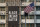 In this June 14, 2020 photo, U.S. flag flutters next to a giant Black Lives Matter banner at the U.S. Embassy in Seoul, South Korea. The  banner has been removed from the U.S. Embassy building in South Korea's capital three days after it was raised there in solidarity with protesters back home.(AP Photo/Lee Jin-man)