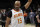 Atlanta Hawks guard Vince Carter (15) wavs to the crowd as he leaves the court following an NBA basketball game against the New York Knicks Wednesday, March 11, 2020, in Atlanta. (AP Photo/John Bazemore)