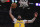 Los Angeles Lakers forward Anthony Davis shoots during the first half of an NBA basketball game against the Philadelphia 76ers Tuesday, March 3, 2020, in Los Angeles. (AP Photo/Mark J. Terrill)