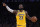 Los Angeles Lakers forward LeBron James gestures to teammates during the second half of an NBA basketball game against the Milwaukee Bucks Friday, March 6, 2020, in Los Angeles. (AP Photo/Mark J. Terrill)