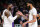 Los Angeles Lakers' LeBron James, left, celebrates with teammate Anthony Davis during a timeout in the second half of an NBA basketball game, Sunday, Dec. 8, 2019, in Los Angeles. The Lakers won 142-125. (AP Photo/Ringo H.W. Chiu)