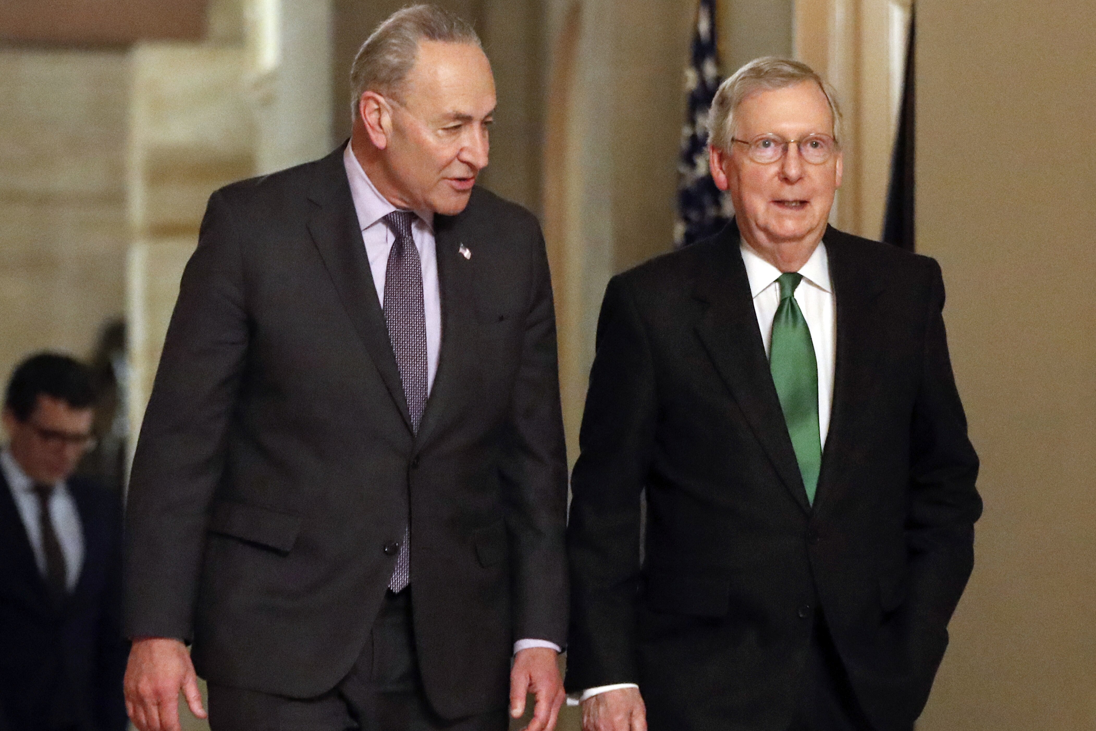 FILE - In this Feb. 7, 2018, file photo, Senate Majority Leader Mitch McConnell, R-Ky., and Senate Minority Leader Chuck Schumer, D-N.Y., left, walk to the chamber the Capitol in Washington. Some of the old timers in the Senate are getting fed up with the drought of legislation. But after weeks of focus on approving President Trump’s backlog of nominees, there’s a chance the chamber will soon be stretching its legs again. (AP Photo/Pablo Martinez Monsivais, File)