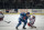 New York Rangers right wing Steve Larmer (28) falls to the ice while trying to stop a charging Quebec Nordiques center Peter Forsberg (21) during second period action of game 3 of their NHL Eastern Conference playoff series, Wednesday, May 10, 1995, at New York?s Madison Square Garden. (AP Photo/Kevin Larkin)
