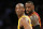 FILE - In this March 10, 2016 file photo, Los Angeles Lakers' Kobe Bryant, left, and Cleveland Cavaliers' LeBron James wait for play to resume during the first half of an NBA basketball game in Los Angeles. For months, the Cavaliers' megastar has lived slightly under the radar, if that's even possible for one of the world's most famous and recognizable athletes. While Stephen Curry rained 3-pointers as the new face of the NBA, the Golden State Warriors hunted down history and Kobe Bryant took his final bows, James remained in the background awaiting his turn. (AP Photo/Danny Moloshok, File)