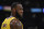 Los Angeles Lakers forward LeBron James stands on the court during the first half of an NBA basketball game against the Philadelphia 76ers Tuesday, March 3, 2020, in Los Angeles. (AP Photo/Mark J. Terrill)