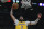 FILE - In this Tuesday, March 3, 2020, file photo, Los Angeles Lakers forward Anthony Davis shoots during the first half of an NBA basketball game against the Philadelphia 76ers in Los Angeles. Davis left his teamâ€™s scrimmage against the Orlando Magic on Saturday, July 25, 2020, after being poked in the right eye and is listed as day-to-day. (AP Photo/Mark J. Terrill, File)