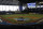 Baseball highlights play on the large screen as the Miami Marlins take batting practice during a baseball workout at Marlins Park, Sunday, July 5, 2020, in Miami. (AP Photo/Wilfredo Lee)