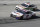 Denny Hamlin (11) drives followed by Kevin Harvick (4) during a NASCAR Cup Series auto race at Bristol Motor Speedway Sunday, May 31, 2020, in Bristol, Tenn. (AP Photo/Mark Humphrey)