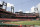 In this general view of Busch Stadium the St. Louis Cardinals play the Pittsburgh Pirates without fans in the stands during the third inning of a baseball game Saturday, July 25, 2020, in St. Louis. (AP Photo/Jeff Roberson)