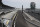 Indianapolis Motor Speedway is empty Sunday, May 24, 2020, in Indianapolis. The Indianapolis 500 was postponed because of the coronavirus pandemic. The race will instead be held Aug. 23, three months later than its May 24 scheduled date. (AP Photo/Darron Cummings)