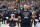 Chicago Bears' Mitchell Trubisky, left, and head coach Matt Nagy link arms during the national anthem before an NFL football game against the New Orleans Saints in Chicago, Sunday, Oct. 20, 2019. (AP Photo/Charles Rex Arbogast)