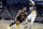 Portland Trail Blazers guard Damian Lillard (0) drives to the basket as New Orleans Pelicans guard Jrue Holiday (11) defends in the first half of an NBA basketball game in New Orleans, Tuesday, Feb. 11, 2020. (AP Photo/Rusty Costanza)
