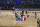 Sacramento Kings center Richaun Holmes (22) jumps for the opening tipoff against Orlando Magic center Nikola Vucevic (9) in anNBA basketball game Sunday, Aug. 2, 2020, in Lake Buena Vista, Fla. (Kim Klement/Pool Photo via AP)