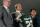 Steve Addazio, center, holds up a jersey during an announcement that he has been hired as the new head football coach at Colorado State University at a news conference at the school Thursday, Dec. 12, 2019, in Fort Collins, Colo. Athletic director Joe Parker, left, and President Joyce McConnell look on. (AP Photo/David Zalubowski)