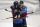 Colorado Avalanche defenseman Cale Makar, back, hugs left wing J.T. Compher, who scored in overtime of the team's NHL hockey game against the New York Rangers on Wednesday, March 11, 2020, in Denver. Colorado won 3-2. (AP Photo/David Zalubowski)