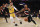 Portland Trail Blazers guard Damian Lillard, right, drives to the basket while Los Angeles Lakers guard Danny Green defends during the first half of an NBA basketball game in Los Angeles, Friday, Jan. 31, 2020. (AP Photo/Kelvin Kuo)