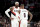 Portland Trail Blazers forward Carmelo Anthony, left, speaks with guard Damian Lillard, right, during a time out in the first half of an NBA basketball game against the Sacramento Kings in Portland, Ore., Wednesday, Dec. 4, 2019. (AP Photo/Steve Dykes)