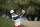China's Haotong Li plays a shot on the 13th hole during the first round of the Dubai Desert Classic golf tournament in Dubai, United Arab Emirates, Thursday, Jan. 23, 2020. (AP Photo/Kamran Jebreili)