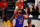 Denver Nuggets' Jamal Murray (27) drives the ball against Utah Jazz's Royce O'Neale and Mike Conley, right, during the second quarter of an NBA basketball game Saturday, Aug. 8, 2020, in Lake Buena Vista, Fla. (Kevin C. Cox/Pool Photo via AP)