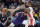 Phoenix Suns guard Devin Booker, left, posts up against Portland Trail Blazers guard Damian Lillard during the first half of an NBA basketball game in Portland, Ore., Monday, Dec. 30, 2019. (AP Photo/Craig Mitchelldyer)