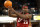 FILE - In this Oct. 29, 2003 file photo,  Cleveland Cavaliers rookie guard LeBron James, passes as he drives the lane during his first regular season NBA basketball game, against the Sacramento Kings, at Arco Arena in Sacramento, Calif. Renamed Sleep Train Arena, the facility has been the home of the Kings since it opened in 1988. The Kings won an NBA-best 61 games in the 2001-02 season behind Chris Webber and Vlade Divac, losing to the eventual champion Lakers in Game 7 of the conference finals. The Kings will play their last game at the aging building, Saturday against the Oklahoma City Thunder and begin play next season at the new Golden One Center built in downtown Sacramento. (AP Photo/Steve Yeater. file)