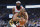 Oklahoma City Thunder guard Chris Paul (3) drives past Houston Rockets guard James Harden during the first half of an NBA basketball game Thursday, Jan. 9, 2020, in Oklahoma City. (AP Photo/Sue Ogrocki)