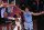 Portland Trail Blazers Damian Lillard (0) shoots the ball against Memphis Grizzlies Brandon Clarke (15) during the second half of an NBA basketball game Friday, July 31, 2020, in Lake Buena Vista, Fla. (Mike Ehrmann/Pool Photo via AP)