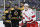 Boston Bruins' Charlie Coyle (13) celebrates his goal as Carolina Hurricanes' Jake Gardiner (51) skates away during the third period of an NHL hockey game in Boston, Tuesday, Dec. 3, 2019. (AP Photo/Michael Dwyer)