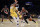 Portland Trail Blazers guard Damian Lillard handles the ball while Los Angeles Lakers forward Anthony Davis defends during the first half of an NBA basketball game in Los Angeles, Friday, Jan. 31, 2020. (AP Photo/Kelvin Kuo)