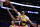 Los Angeles Lakers forward Anthony Davis, top, blocks a shot by Portland Trail Blazers guard Damian Lillard during the first half of an NBA basketball game in Los Angeles, Friday, Jan. 31, 2020. (AP Photo/Kelvin Kuo)