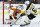Philadelphia Flyers' Carter Hart, left, blocks a shot by Boston Bruins' Brad Marchand during the third period of an NHL hockey game, Tuesday, March 10, 2020, in Philadelphia. Boston won 2-0. (AP Photo/Matt Slocum)