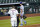 Los Angeles Dodgers relief pitcher Joe Kelly (17) talks toward Houston Astros' Carlos Correa (1) after the sixth inning of a baseball game Tuesday, July 28, 2020, in Houston. Kelly received an eight-game suspension for his actions after he threw a pitch in the area of the head of Houston Astros' Alex Bregman and later taunted Correa, which led to the benches clearing. (AP Photo/David J. Phillip)