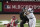 New York Yankees' Derek Jeter hits a single during the third inning of Game 6 of the Major League Baseball World Series Wednesday, Nov. 4, 2009, in New York. Philadelphia Phillies' Carlos Ruiz is catching. Umpire is Joe West.  (AP Photo/Eric Gay)
