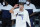 Dallas Mavericks' Luka Doncic (77) congratulates teammates at the end of an NBA basketball game against the Los Angeles Clippers Wednesday, Aug. 19, 2020, in Lake Buena Vista, Fla. Dallas won 127-114. (AP Photo/Ashley Landis, Pool)