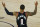 Portland Trail Blazers' Damian Lillard calls for a foul against the Memphis Grizzlies during the second half of an NBA basketball game Saturday, Aug. 15, 2020, in Lake Buena Vista, Fla. (Kevin C. Cox/Pool Photo via AP)
