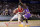 LaMelo Ball of the Illawarra Hawks drives past Jae'Sean Tate of the Sydney Kings during their game in the Australian Basketball League in Sydney, Sunday, Nov. 17, 2019. (AP Photo/Rick Rycroft)