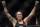 Amanda Nunes celebrates after defeating Germaine de Randamie in a mixed martial arts women's bantamweight championship bout at UFC 245, Saturday, Dec. 14, 2019, in Las Vegas. (AP Photo/John Locher)