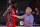 Philadelphia 76ers' head coach Brett Brown, right, talks with Norvel Pelle during the second quarter of an NBA basketball game against the Portland Trail Blazers, Sunday, Aug. 9, 2020, in Lake Buena Vista, Fla. (Kevin C. Cox/Pool Photo via AP)