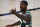 Milwaukee Bucks' Marvin Williams reacts to a call during the fourth quarter of an NBA basketball game against the Dallas Mavericks, Saturday, Aug. 8, 2020, in Lake Buena Vista, Fla. (Kevin C. Cox/Pool Photo via AP)