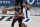 Miami Heat forward Jimmy Butler (22) moves the ball around Indiana Pacers forward T.J. Warren (1) during the first half of an NBA basketball first round playoff game, Saturday, Aug. 22, 2020, in Lake Buena Vista, Fla. (AP Photo/Ashley Landis, Pool)