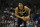 Milwaukee Bucks forward Giannis Antetokounmpo runs the offense against the Charlotte Hornets in the first half of an NBA basketball game in Charlotte, N.C., Sunday, March 1, 2020. Milwaukee won 93-85. (AP Photo/Nell Redmond)