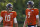 FILE - In this Aug. 17, 2020, file photo, Chicago Bears quarterbacks Mitchell Trubisky, left, and Nick Foles walk on the field during an NFL football camp practice in Lake Forest, Ill. The Bears acquired Super Bowl 52 MVP Foles to compete with former No. 2 draft pick Trubisky for the starting quarterback job, one of several moves to shake up an offense that ranked among the NFL's worst last season. (AP Photo/Nam Y. Huh, File)