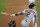 Houston Astros' Alex Bregman follows the flight of his double to lead off the fourth inning of a baseball game Wednesday, Aug. 19, 2020, in Denver. Bregman limped to second base and was removed from the game before play resumed. (AP Photo/David Zalubowski)