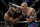 Anthony Smith, right, hits Jon Jones during a light heavyweight mixed martial arts title bout at UFC 235, Saturday, March 2, 2019, in Las Vegas. (AP Photo/John Locher)