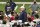 Players take a knee as Dallas Cowboys head coach Mike McCarthy speaks during an NFL training camp practice in Frisco, Texas, Thursday, Aug. 27, 2020. (AP Photo/LM Otero)